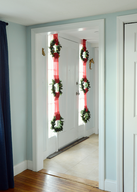 Easy DIY Christmas Wreath Window Display /// By Design Fixation