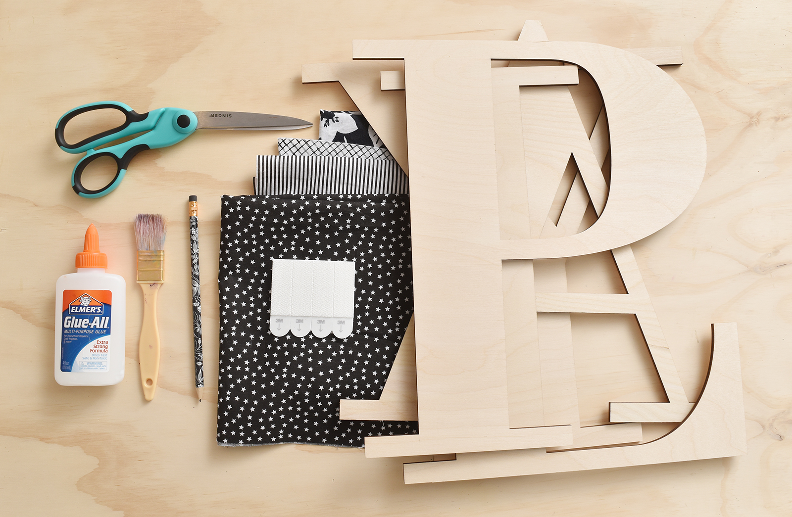 Playroom Update: Easy DIY Fabric-Covered Wooden Letters /// By Design Fixation #typography #home_decor #playroom #kids